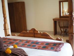 Kampung Sari Homestay客房内的一张或多张床位