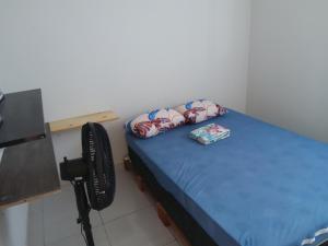 a small room with a bed with a camera at Residencial Água Viva Extra in Jacumã