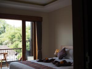 Kampung Sari Homestay客房内的一张或多张床位