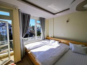 Postel nebo postele na pokoji v ubytování Sơn Liễu Homestay