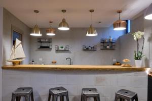 Kuchyň nebo kuchyňský kout v ubytování La Via del Porto Charme Rooms + 34 fotografií