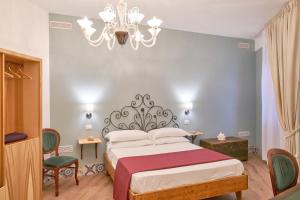 Postel nebo postele na pokoji v ubytování La Via del Porto Charme Rooms