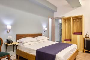 Postel nebo postele na pokoji v ubytování La Via del Porto Charme Rooms