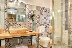 Koupelna v ubytování La Via del Porto Charme Rooms
