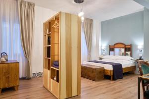 Postel nebo postele na pokoji v ubytování La Via del Porto Charme Rooms