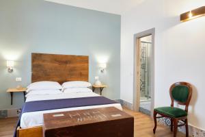 Postel nebo postele na pokoji v ubytování La Via del Porto Charme Rooms