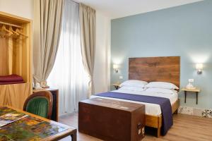 Postel nebo postele na pokoji v ubytování La Via del Porto Charme Rooms