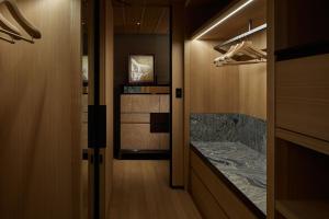 a hallway with a marble counter in a room at Park Hyatt Kyoto in Kyoto