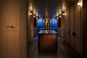 a dressing room with a counter and a view of a building at Park Hyatt Kyoto in Kyoto