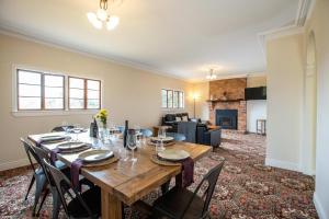 a dining room with a wooden table and chairs at Mason Winery in Mount Tamborine