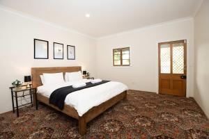 a bedroom with a large bed in a room at Mason Winery in Mount Tamborine