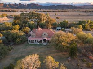 an aerial view of a house in a field at Welgeluk Feather Palace in Oudtshoorn
