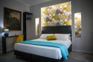 Ένα ή περισσότερα κρεβάτια σε δωμάτιο στο Principessa Isabella Luxury Rooms