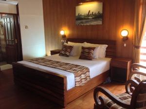 a bedroom with a large bed in a room at Nilaveli Beach Resort - Level 1 Certified in Nilaveli