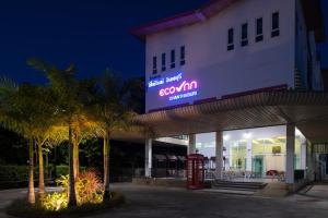 a building with a sign on the side of it at Eco Inn Lite Chanthaburi in Chanthaburi