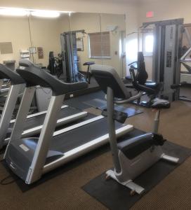 a gym with treadmills and elliptical machines at Candlewood Suites Avondale-New Orleans, an IHG Hotel in Avondale