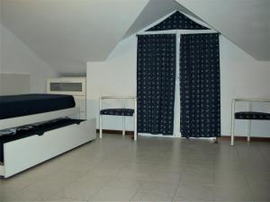 A bed or beds in a room at Appartamento - terrazzo vivibile vista mare, wi-fi gratuito