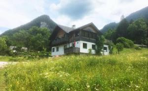 a house on a hill in a field of grass at Haus Höber in Archkogel