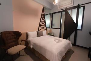 Postel nebo postele na pokoji v ubytování 東立方旅宿-East Cube B&B