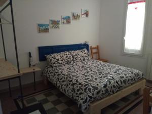 A bed or beds in a room at I Cavalieri di Malta