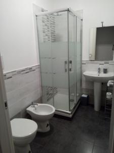 a bathroom with a shower and a toilet and a sink at I Cavalieri di Malta in Palermo