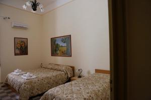 A bed or beds in a room at I Cavalieri di Malta