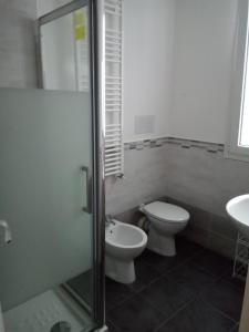 a bathroom with a toilet and a sink at I Cavalieri di Malta in Palermo
