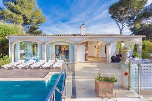 a house with a pool and a gazebo at YupiHome Villa Romana Bonaire in Alcudia