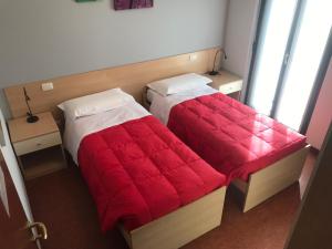 Posteľ alebo postele v izbe v ubytovaní Hotel del Boschetto