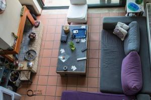 an overhead view of a living room with a couch at Theo Pool Villa Magnificent Sea View in Kapandrítion