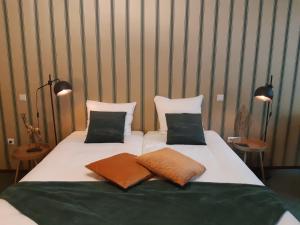 Voodi või voodid majutusasutuse Hotel Johannes Vermeer Delft toas