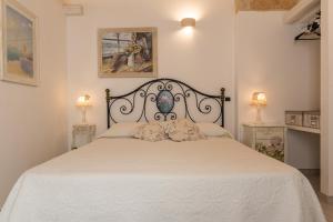 Postel nebo postele na pokoji v ubytování Carpe Diem B&B e Case Vacanza