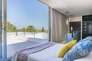 Ένα ή περισσότερα κρεβάτια σε δωμάτιο στο Villa Sa Torre - Family Only +27 φωτογραφίες