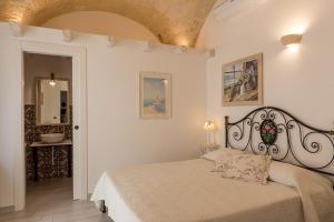 Postel nebo postele na pokoji v ubytování Carpe Diem B&B e Case Vacanza