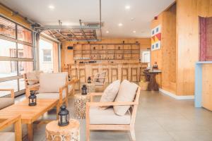 a room with wooden walls and a table and chairs at Wanderlust José Ignacio in José Ignacio