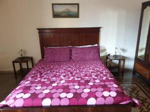 a bed with a white bedspread and pillows at I Cavalieri di Malta in Palermo