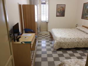A bed or beds in a room at I Cavalieri di Malta