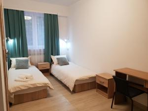Postel nebo postele na pokoji v ubytování Hostel Mleczna - Metro Zacisze