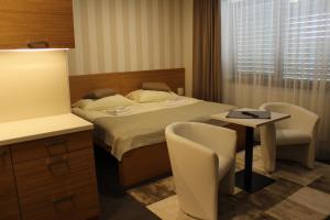 Posteľ alebo postele v izbe v ubytovaní Apartments 461