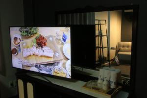 a flat screen tv sitting on top of a table at Seong Dong Jang in Daegu