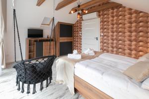 Posteľ alebo postele v izbe v ubytovaní Apartamenty Marron z sauną, bawialnią i widokiem na Skrzyczne - Dream Apart