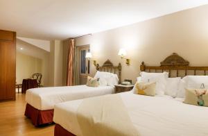 Rúm í herbergi á Hotel Andria