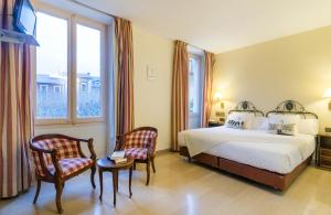 Rúm í herbergi á Hotel Andria