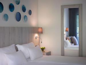 Letto o letti in una camera di Amus Hotel & Spa