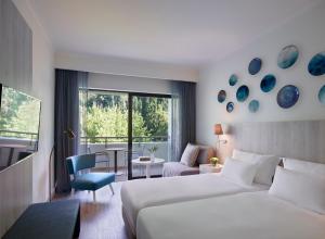 Letto o letti in una camera di Amus Hotel & Spa
