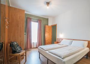 Llit o llits en una habitació de Residence Fior d'Alpe