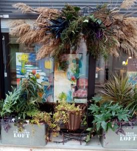 a wreath on a window of a flower shop at le dit vin secret in Aigues-Mortes