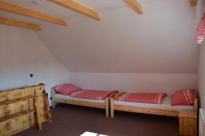 Postel nebo postele na pokoji v ubytování Penzion U podkováře