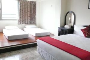 Postel nebo postele na pokoji v ubytování Kuo Kuang Hostel