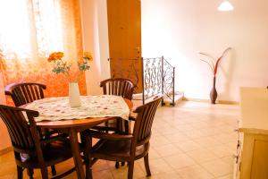 a dining room with a table and chairs at Marisal Accommodation in Alghero